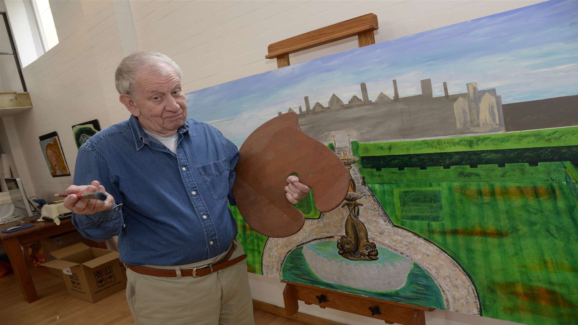Artist Paul Joyce with his unfinished Eastwell Manor piece. Picture by Chris Davey