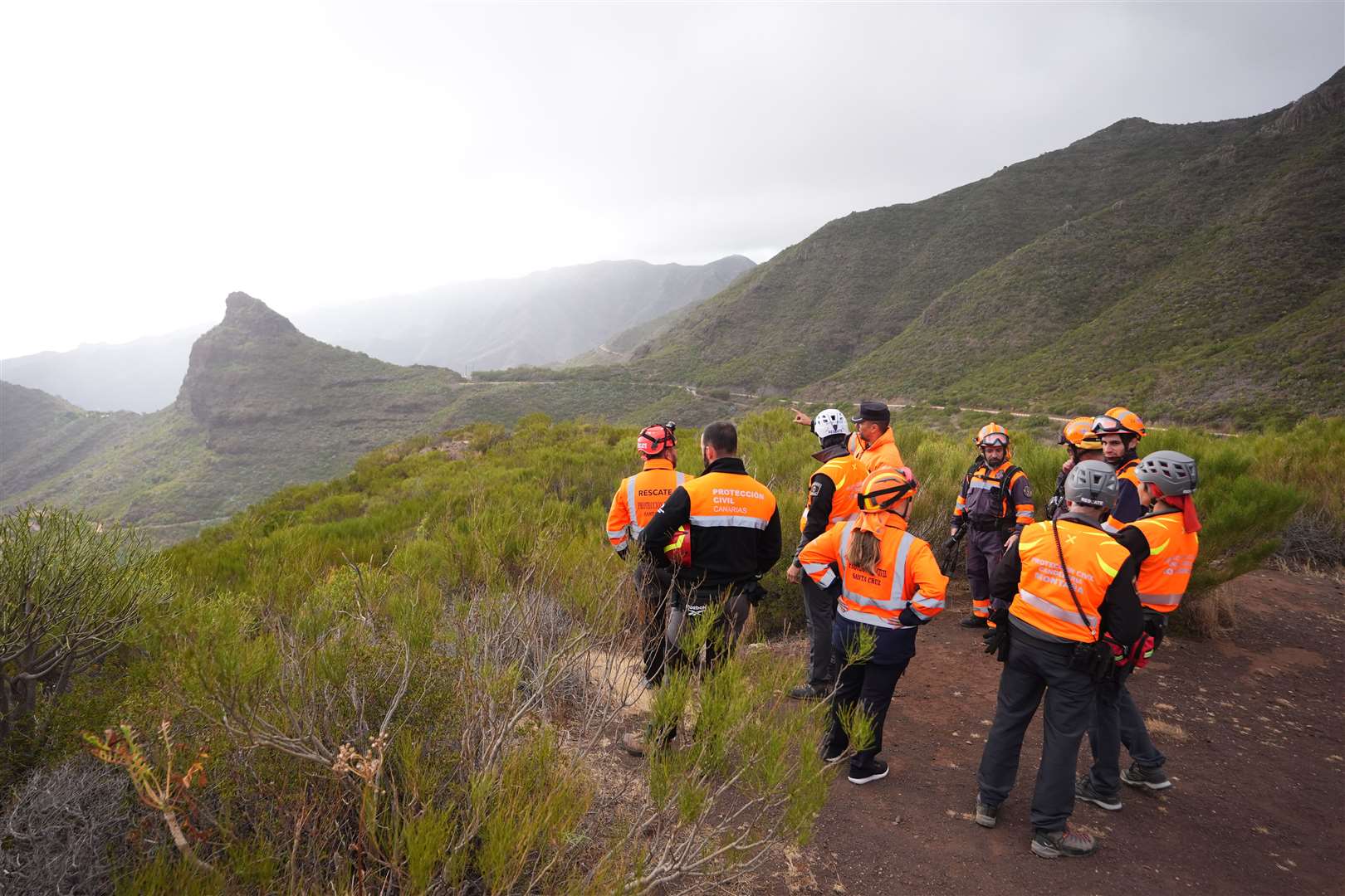 A group of search and rescue workers near to the village of Masca during the hunt for the 19-year-old (James Manning/PA)