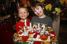 Children making Chritingles at a craft fair at St Mary Magdalene Church