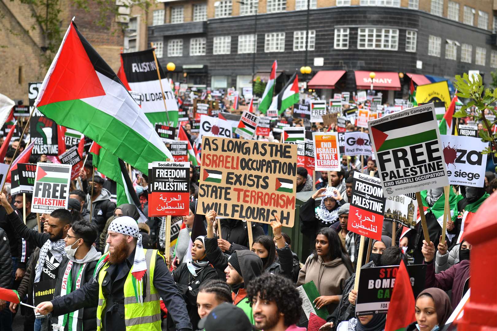 Demonstrators walk through Kensington (Dominic Lipinski/PA)