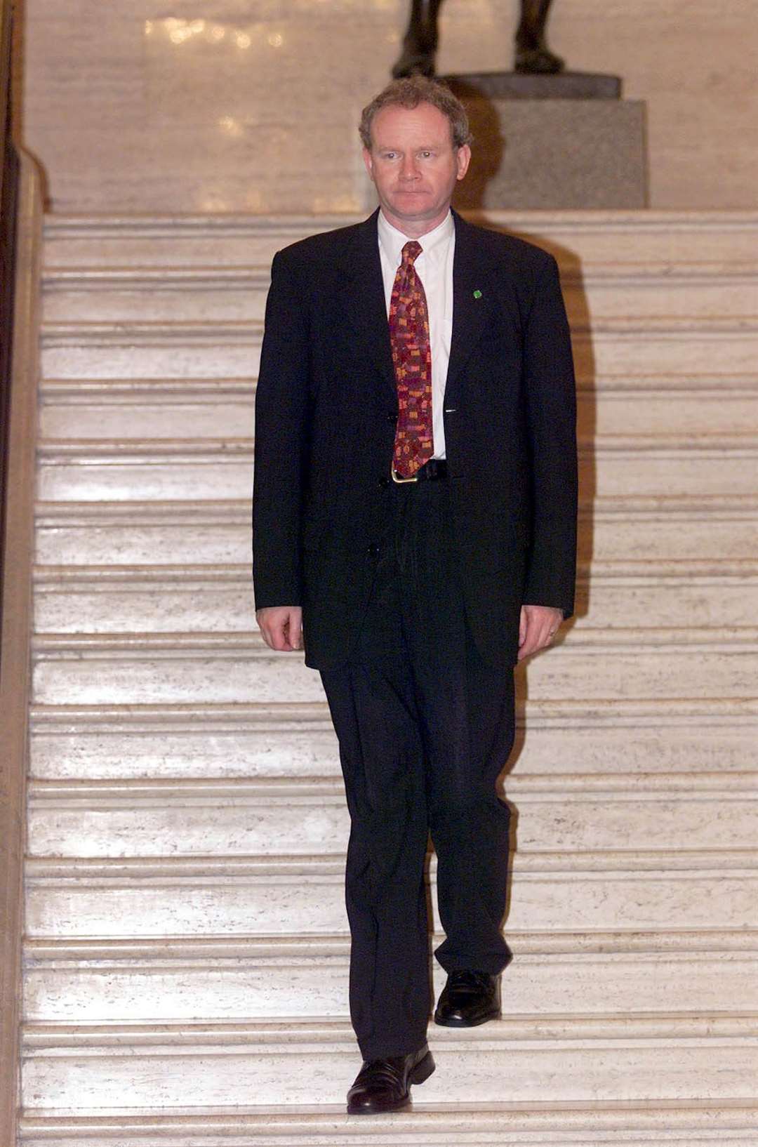 Education minister Martin McGuinness of Sinn Fein makes his way to the first sitting of the Northern Assembly at Stormont in Belfast (PA)