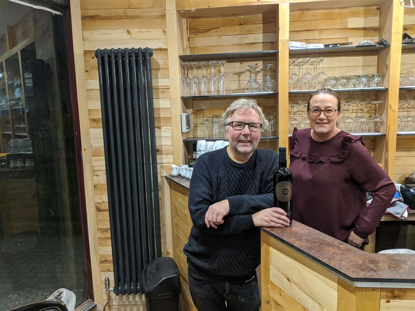 Dave Robinson and partner Abi behind the bar at Vinoteq, which will open and close for lockdown on the same day