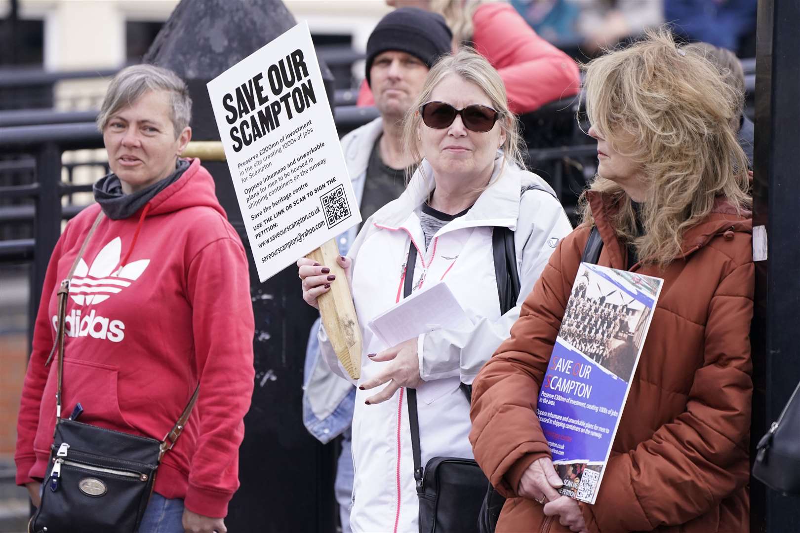 People take part in a protest in Lincoln, against the Government’s plan to house migrants at RAF Scampton (PA)