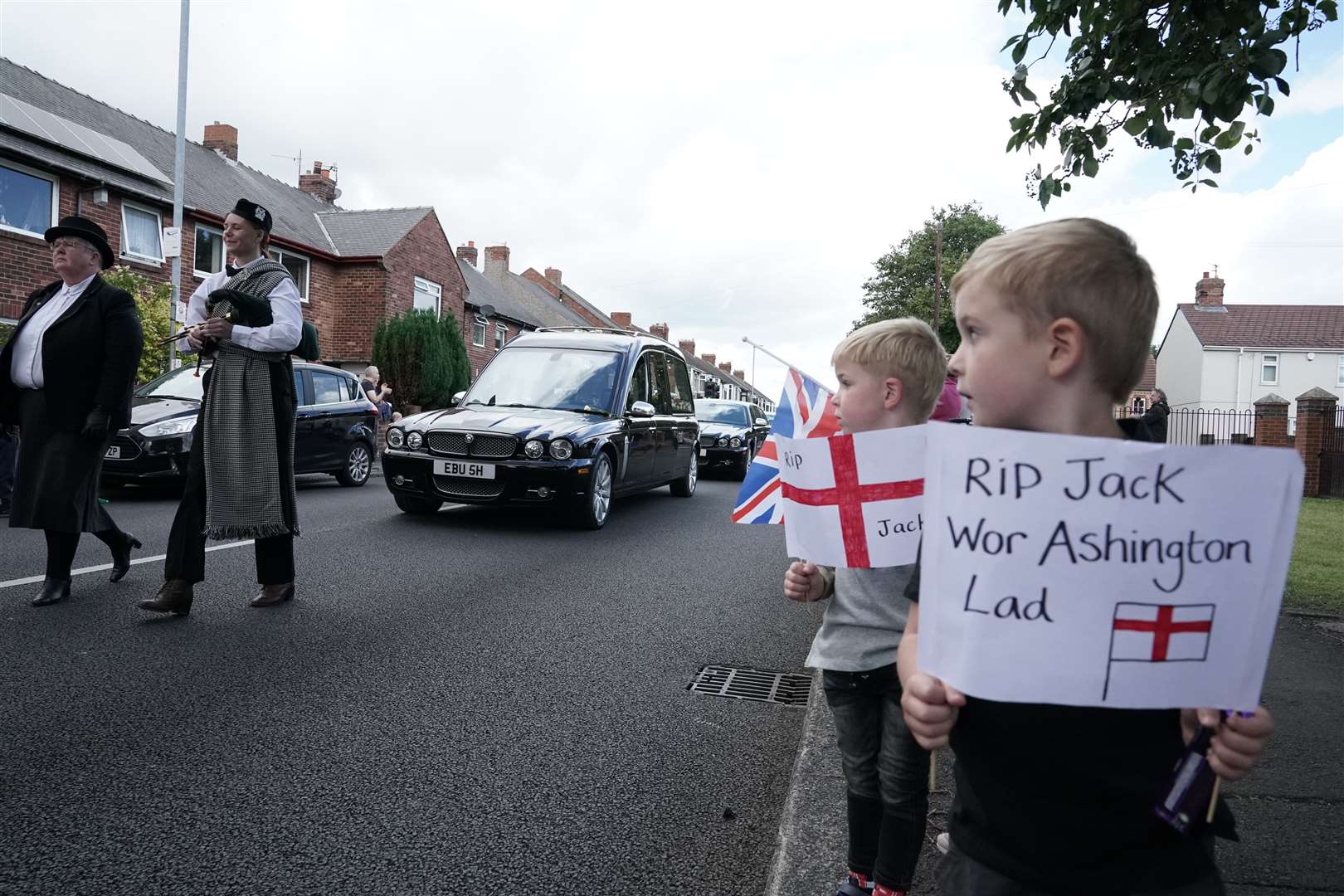 People of all ages lined the streets in Charlton’s home town of Ashington (Owen Humphreys/PA)