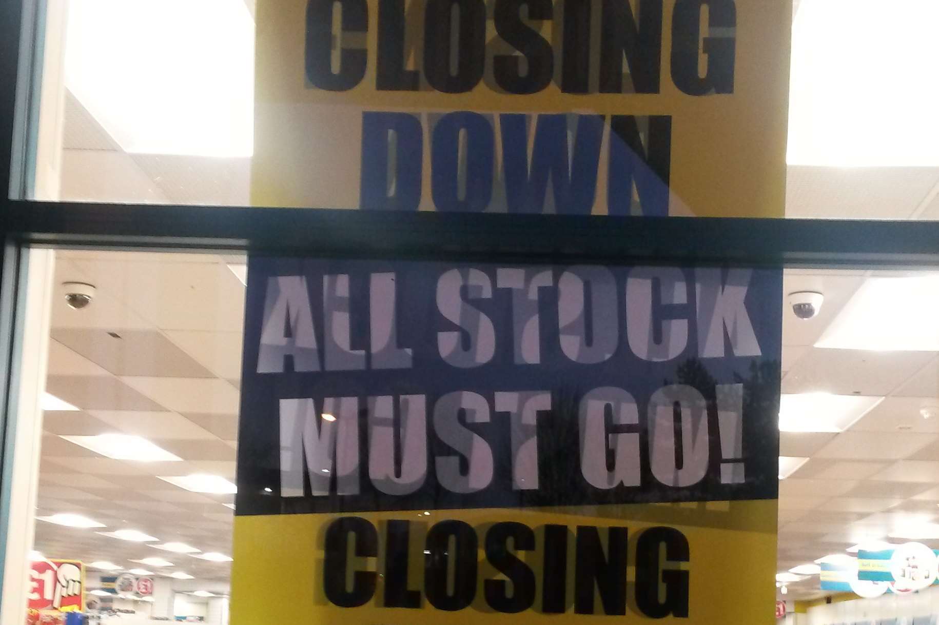 A closing down sign in the window of the Poundland store on Ashford's Warren Retail Park