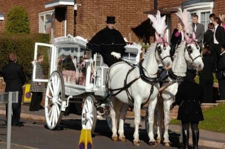 The white horses and carriage hearse outside Molly Bubb's home