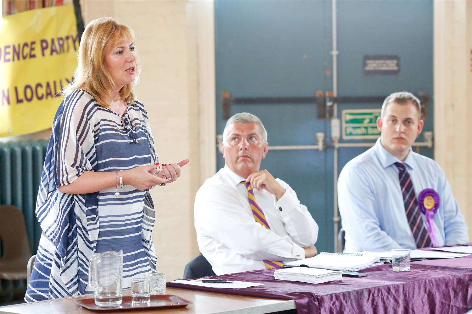 MEP Janice Atkinson addresses the meeting, watched by Cllr Eddie Powell and Jamie Kalmar