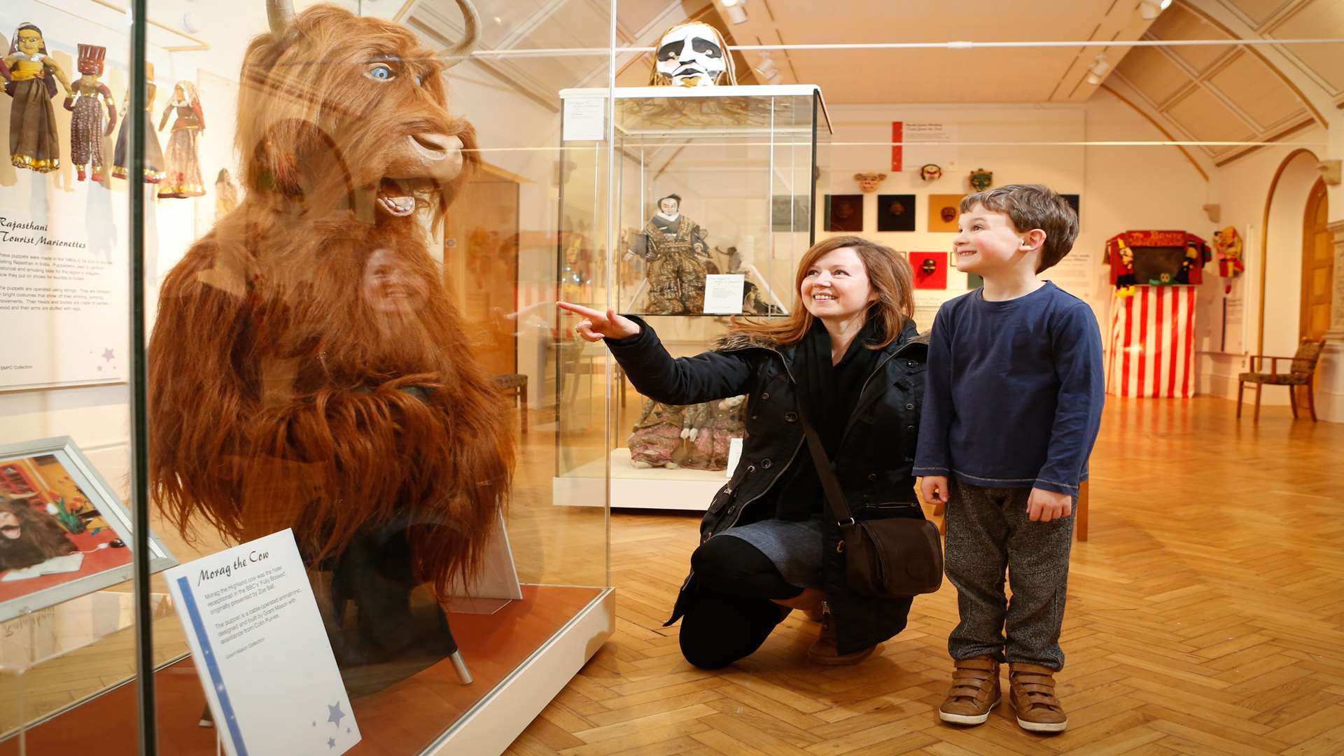 Ashley Wright with mum Wanda Sullivan looking at the Morag the Cow display