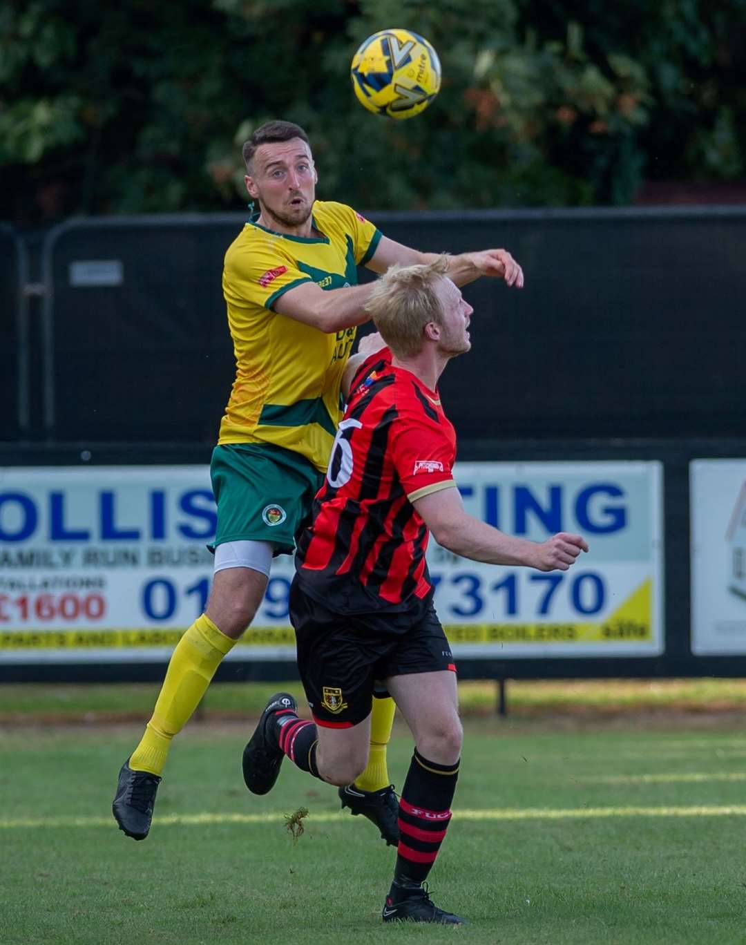 Ashford’s Ben Gorham wins the aerial battle against Sittingbourne. Picture: Ian Scammell/Isobel Scammell