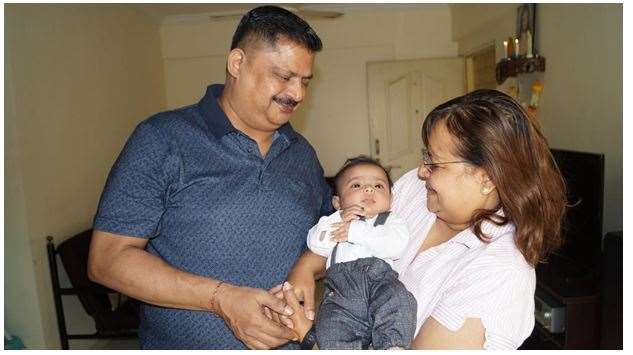 Mr Rose’s parents with his infant son (Vernon Rose/PA)