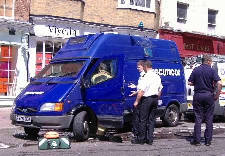 Firefighters and paramedics work to free the man from the vehicle. Picture: EVE PARISH