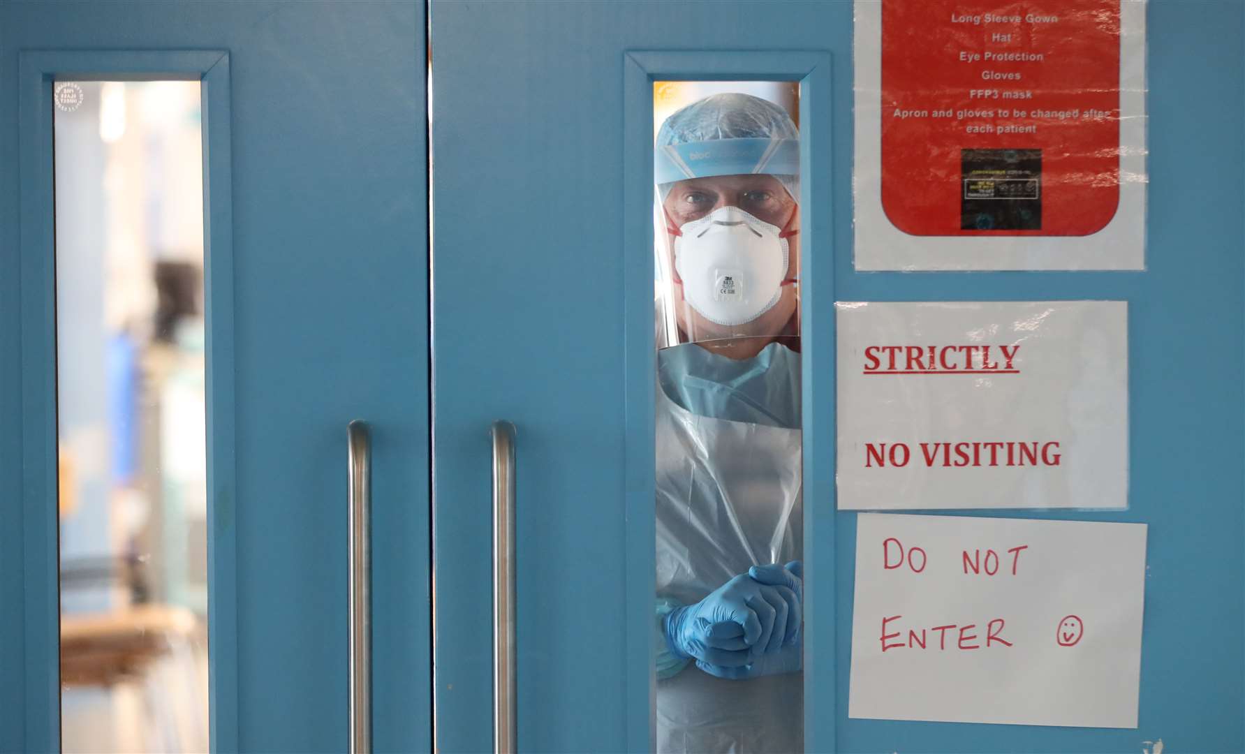 Infection Control nurse Colin Clarke looks out from a Covid-19 recovery ward at Craigavon Area Hospital in Co Armagh, Northern Ireland (Liam McBurney/PA)