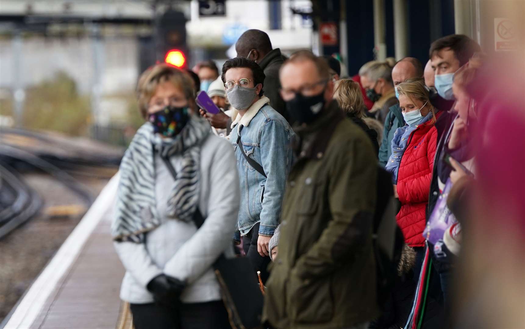 People waiting on a railway platform on Tuesday (Gareth Fuller/PA)