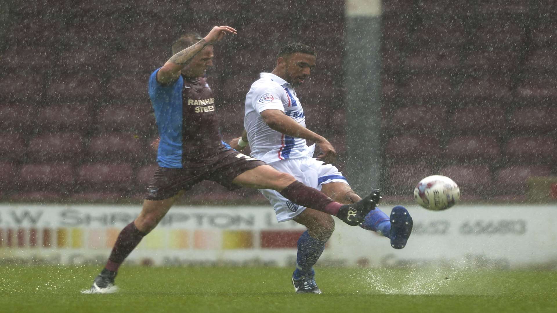 Leon Legge plays the ball forward for Gillingham at Scunthorpe Picture: Barry Goodwin