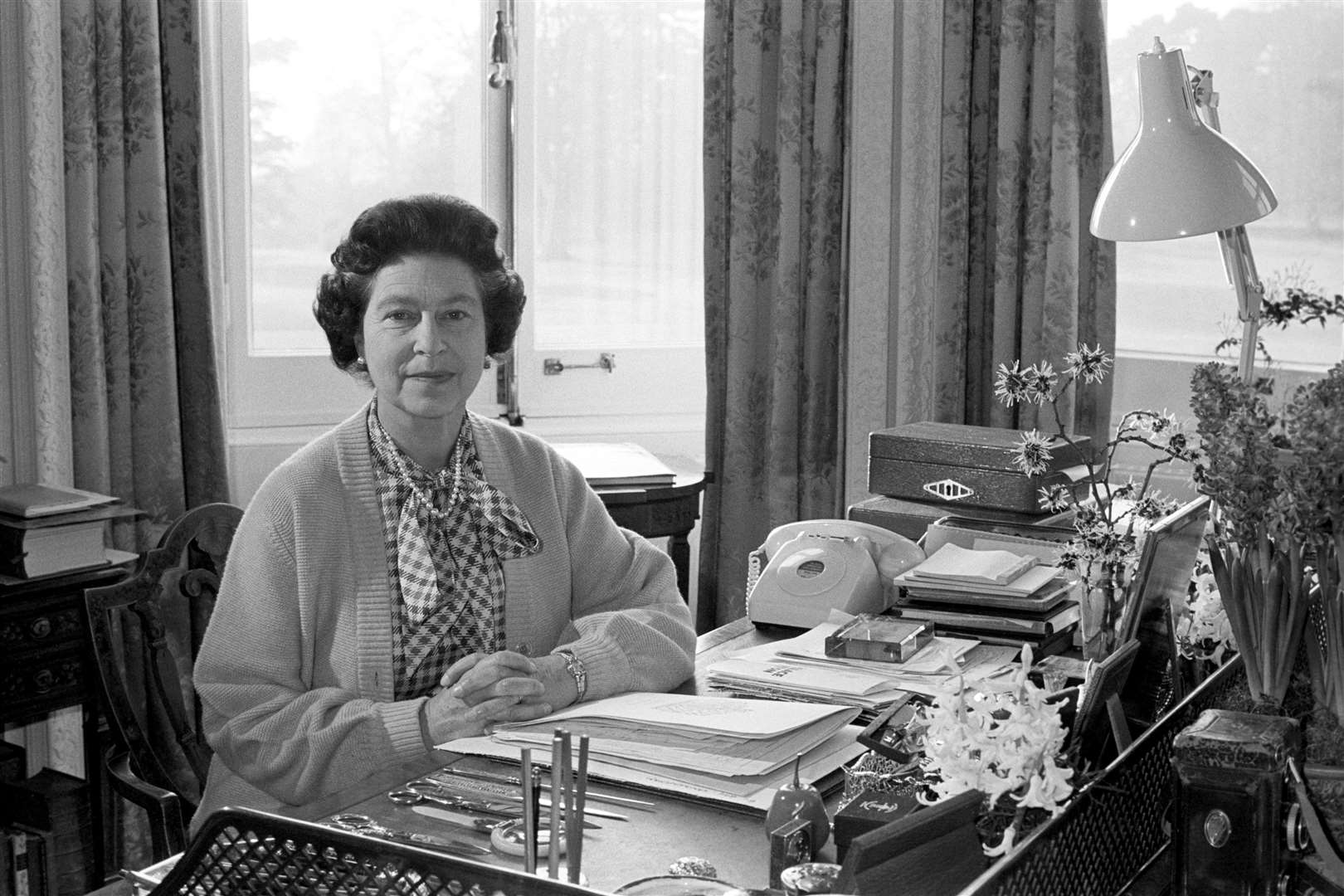 The Queen at her desk in the study of Sandringham House, on the 30th anniversary of her accession to the throne in 1982 (Ron Bell/PA)