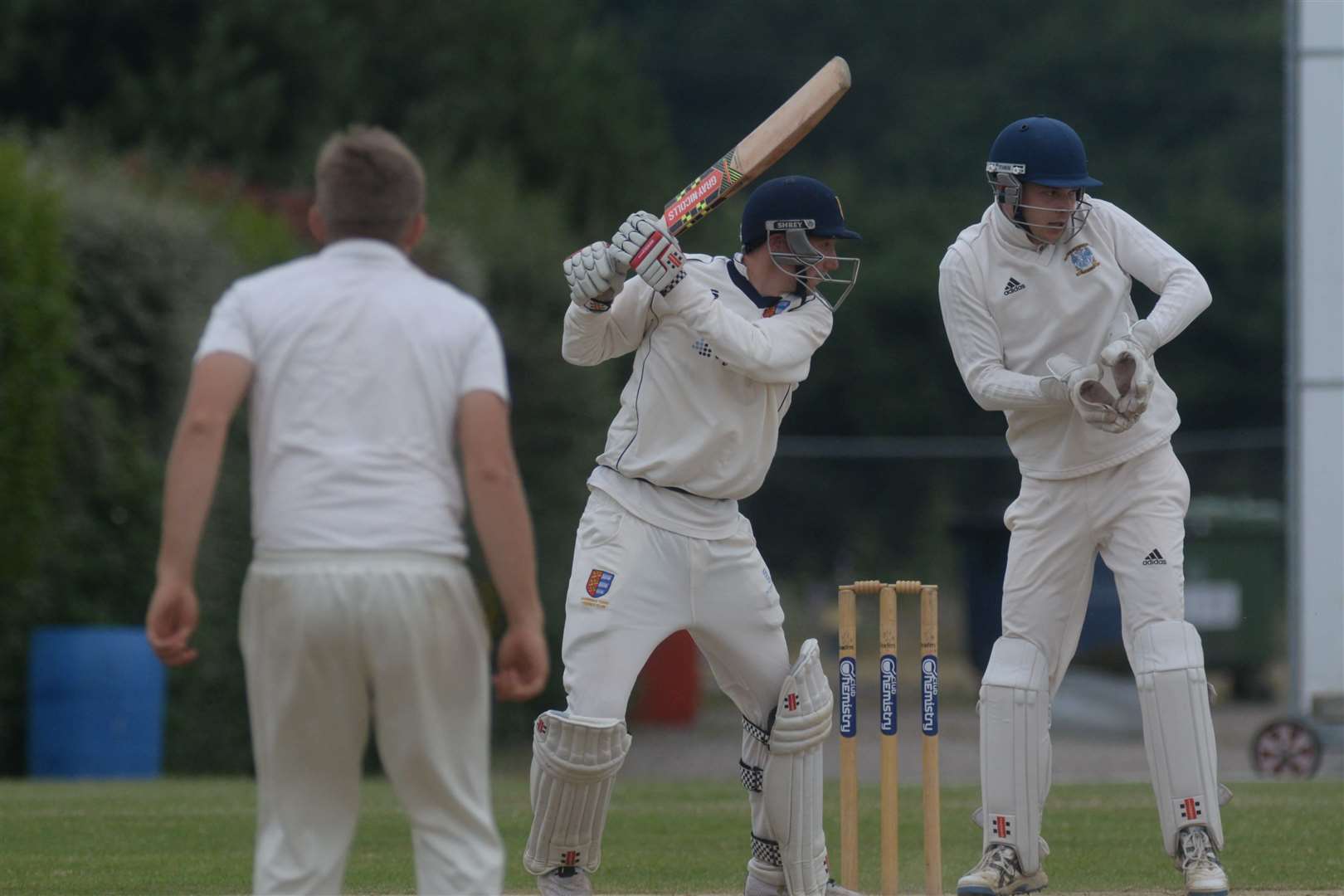 Canterbury keeper Sam Burt watches Sandwich batsman Ben Chapman during the match at Polo Farm on Saturday. Picture: Chris Davey. (13765172)