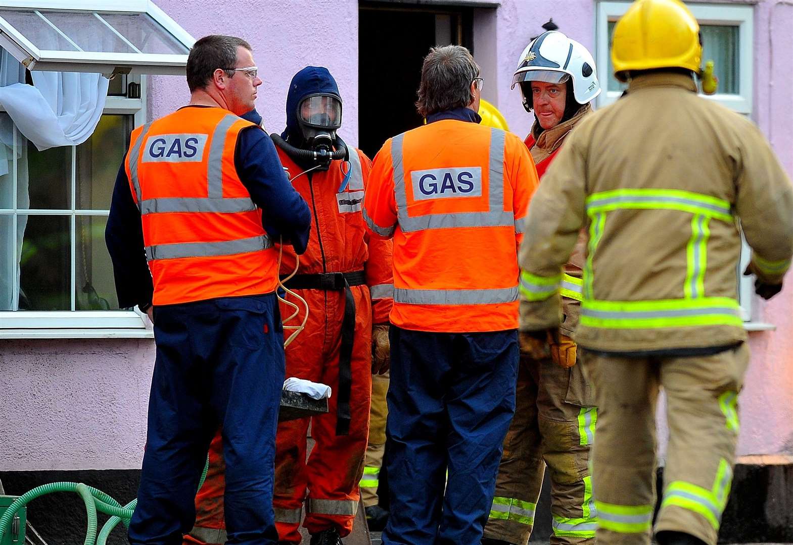 Fire crews and gas engineers at the scene of a gas leak. Stock image