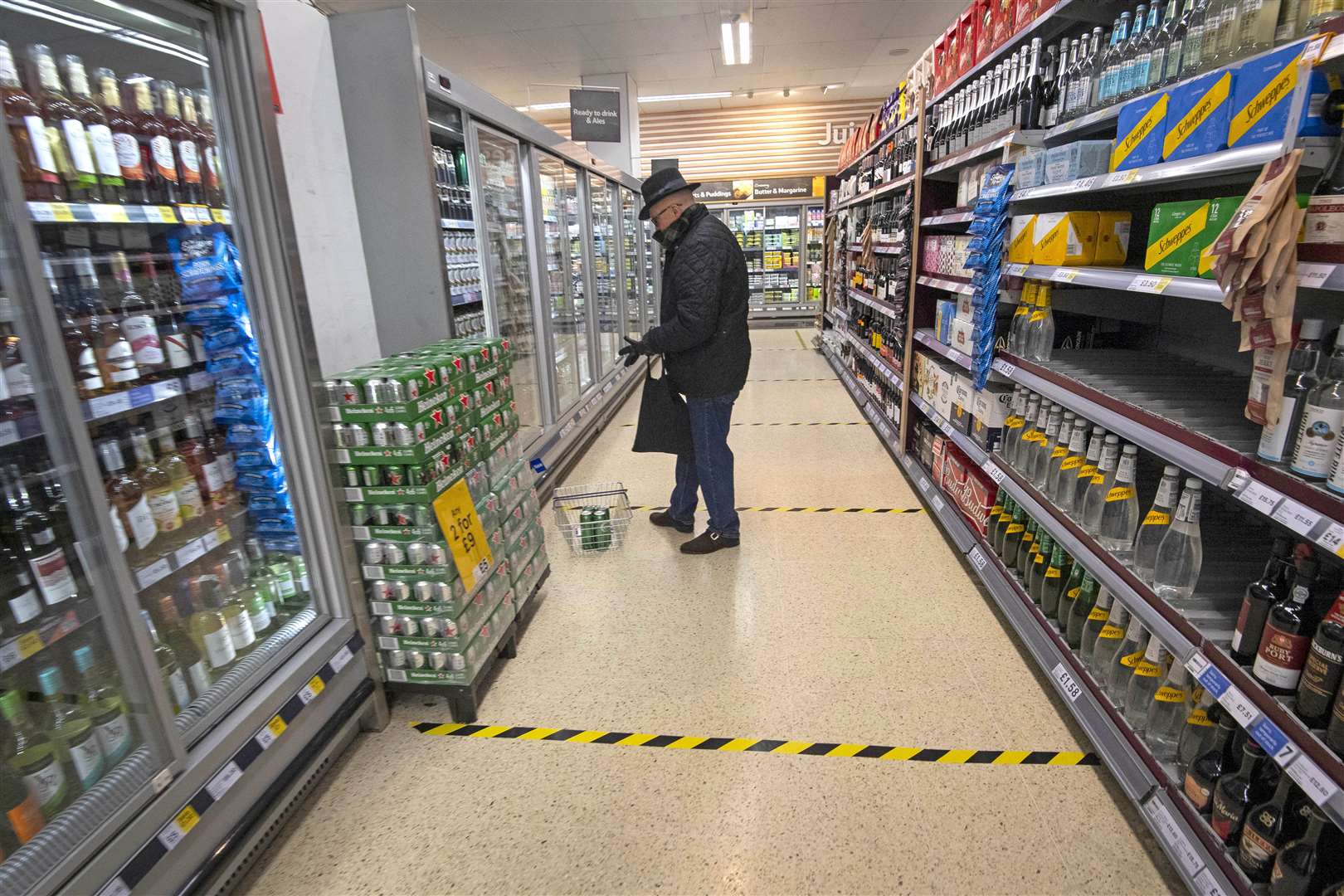 Social distancing markers on the floor of a supermarket (Victoria Jones/PA)