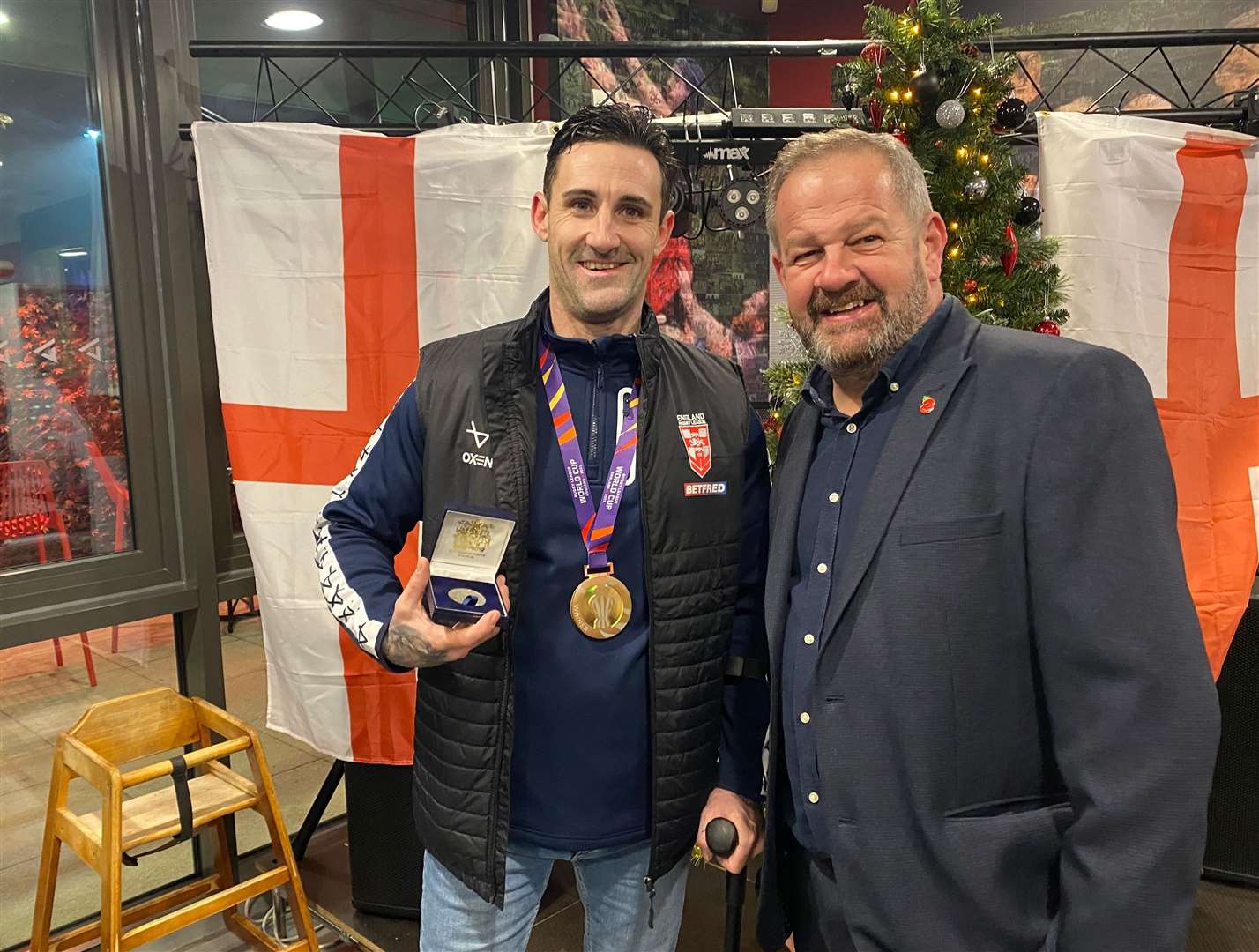 Wheelchair Rugby League World Cup winner Lewis King displays his award and World Cup winner's medal alongside Cllr Chris Shippam. Photo: Dartford council