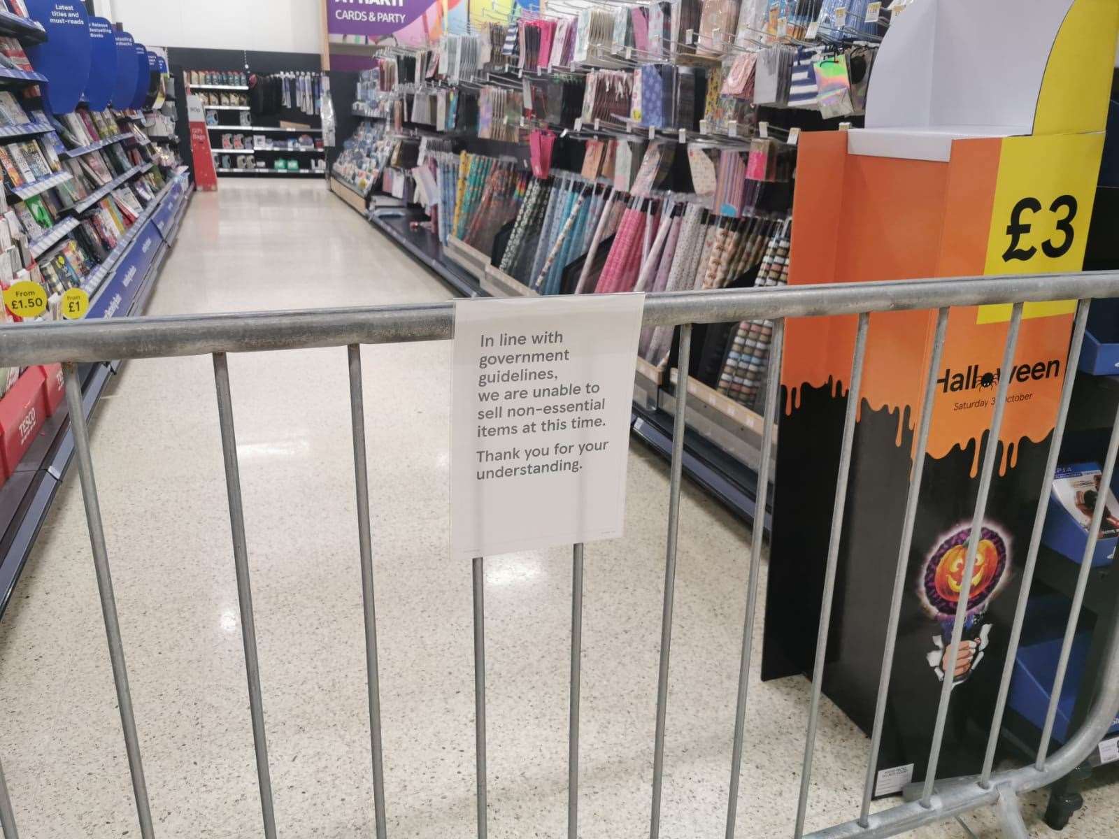 A notice informing customers of the sales of non-essential products at a Tesco Extra store in Pengam Green, Wales (Adam Hale/PA)