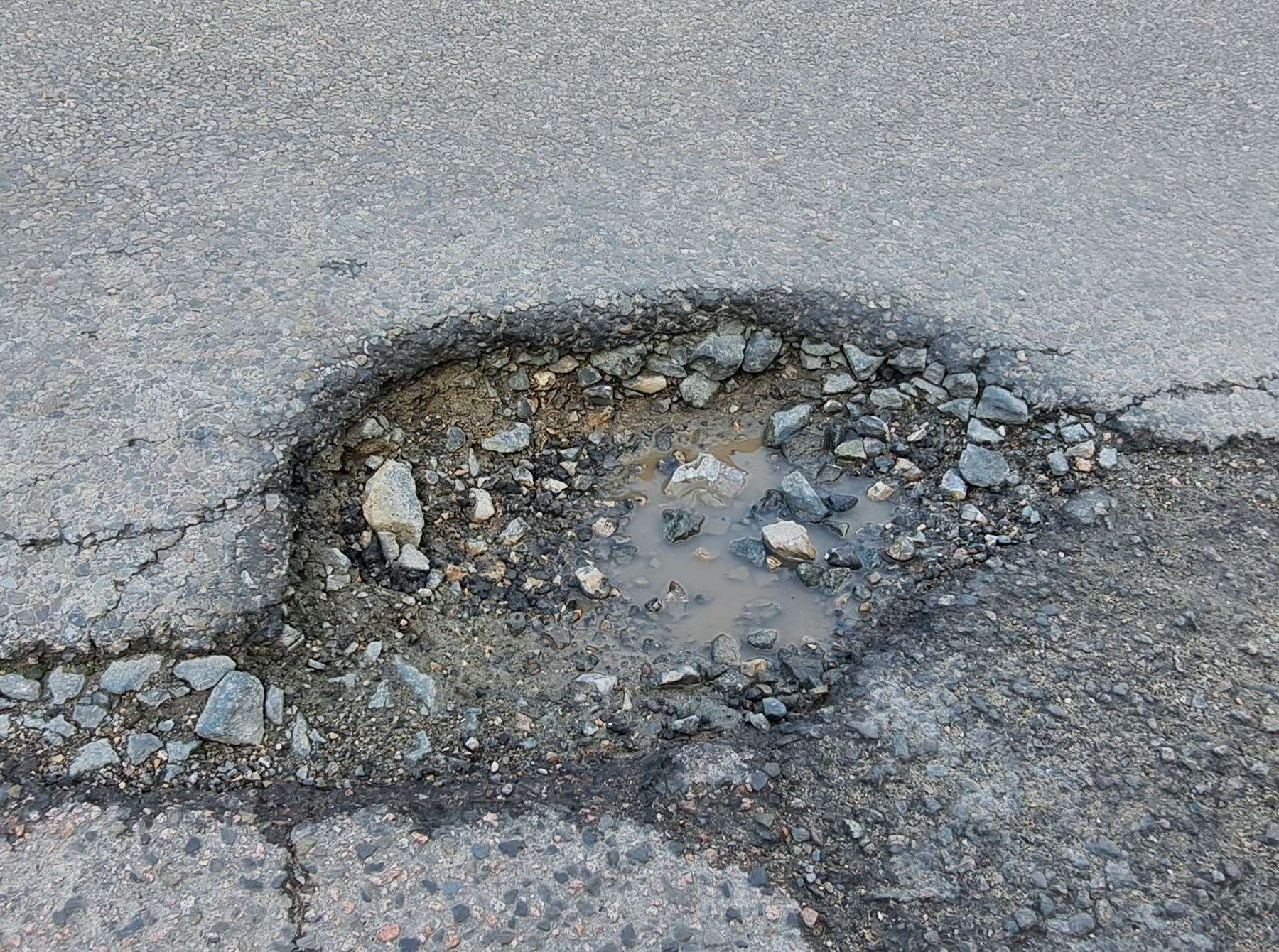 One of two deep potholes at Belgrave Road, Dover