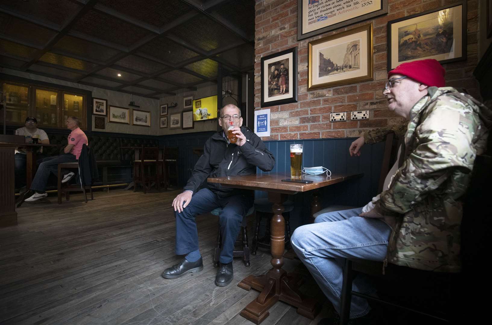 Customers at a pub in Edinburgh (Jane Barlow/PA)