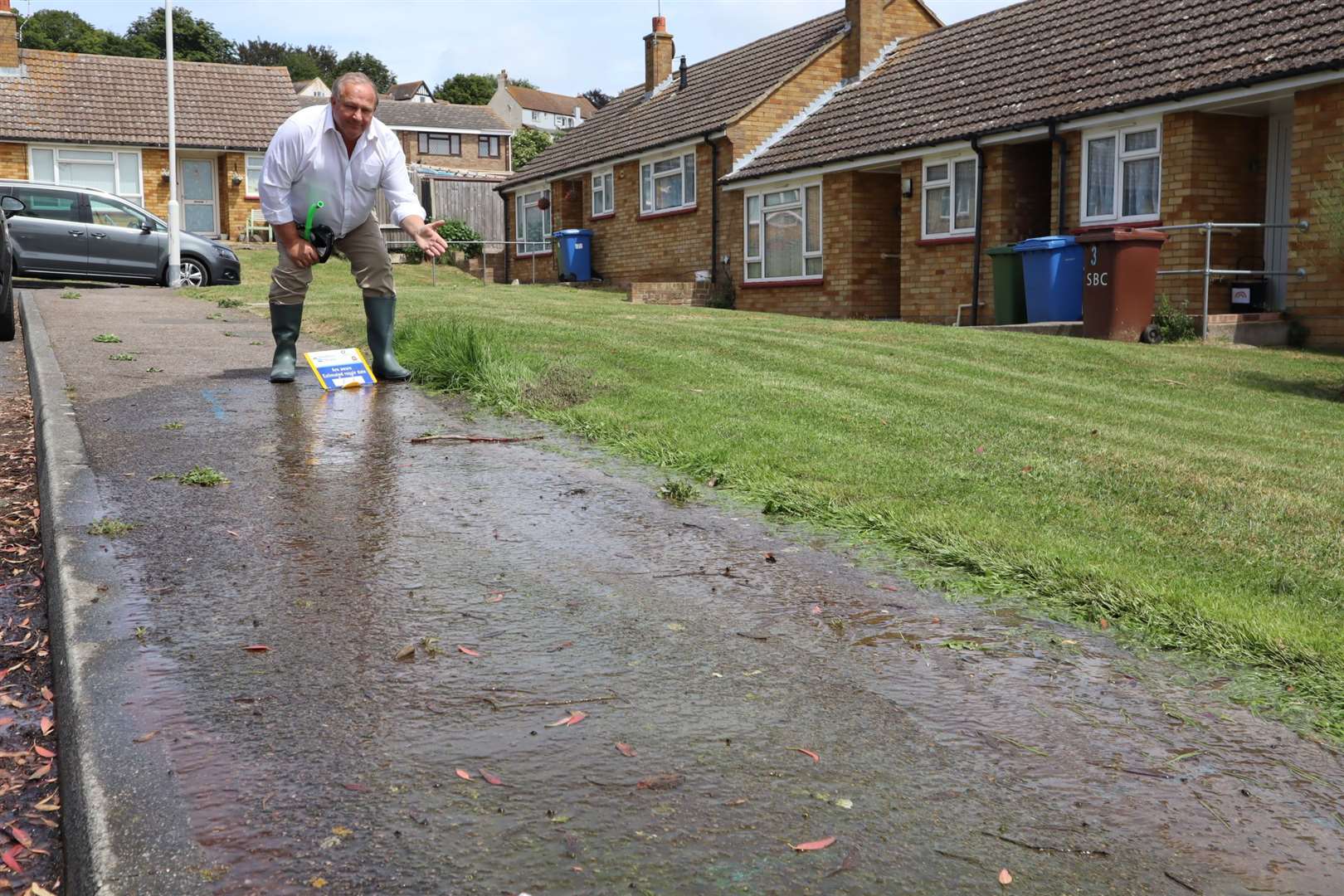 Sheppey businessman Sean D'Alton checks out the water leak in Petfield Close, Minster