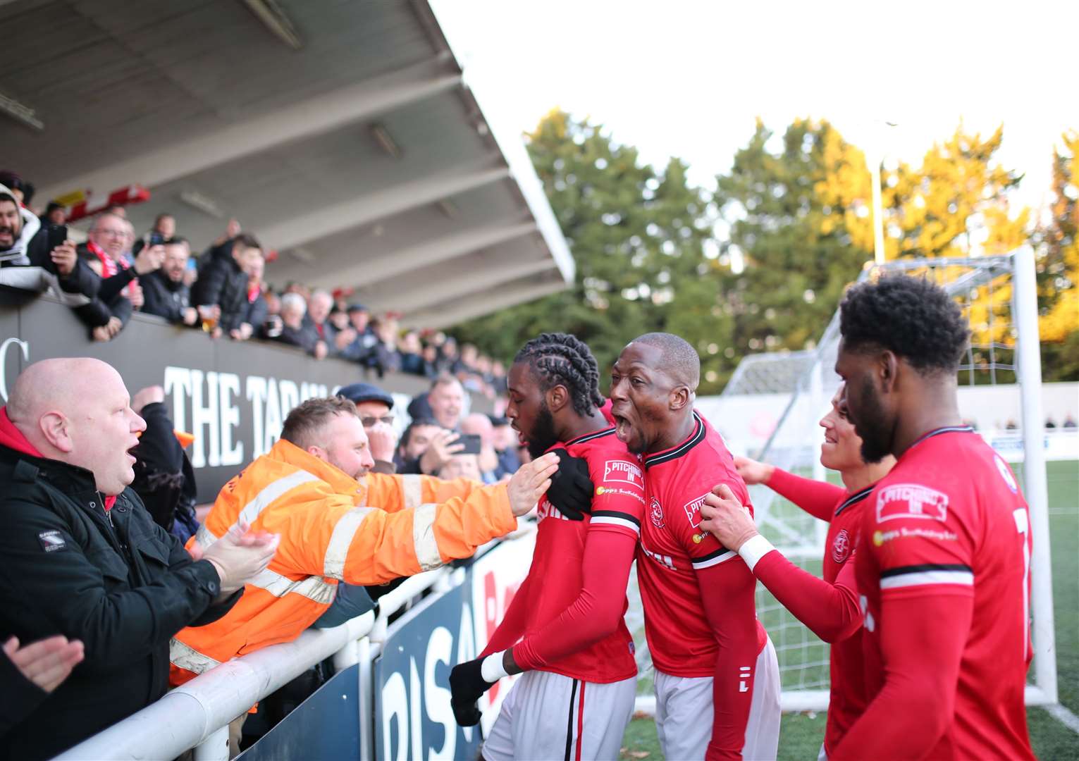 Jamie Yila celebrating with fans after scoring a penalty for Chatham Picture: Max English (@max_ePhotos)