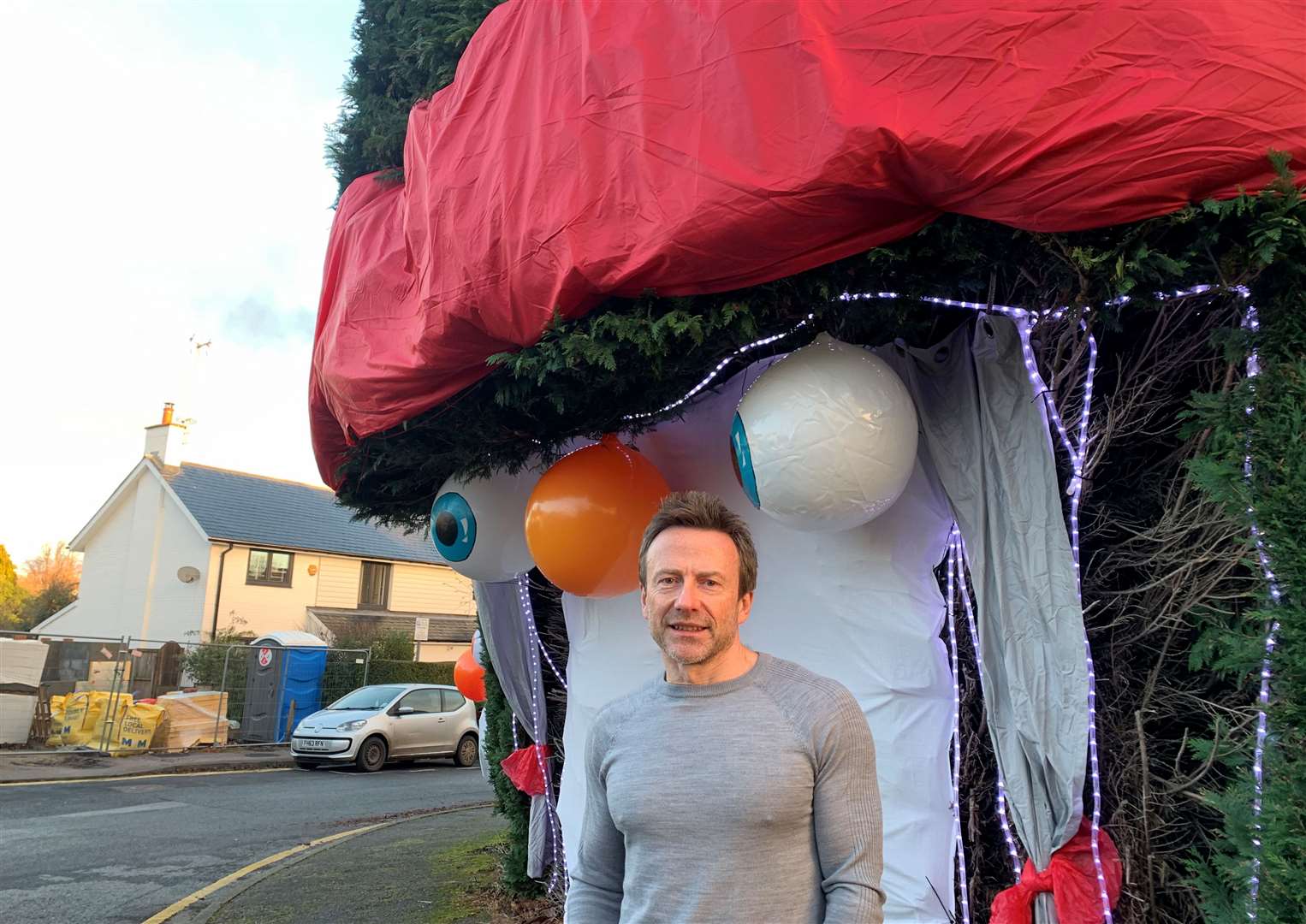 Canterbury resident David Hampson decorates his conifer trees every year in honour of his late wife Sara