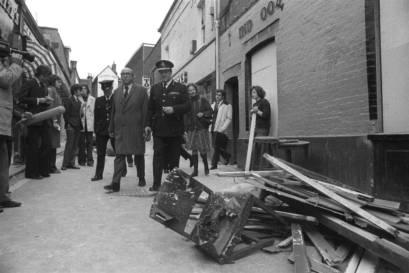 The Home Secretary Roy Jenkins (l), accompanied by Peter Matthews, the Chief Constable of Surrey, leaves the Seven Stars public house, one of the pubs bombed in Guildford (PA)