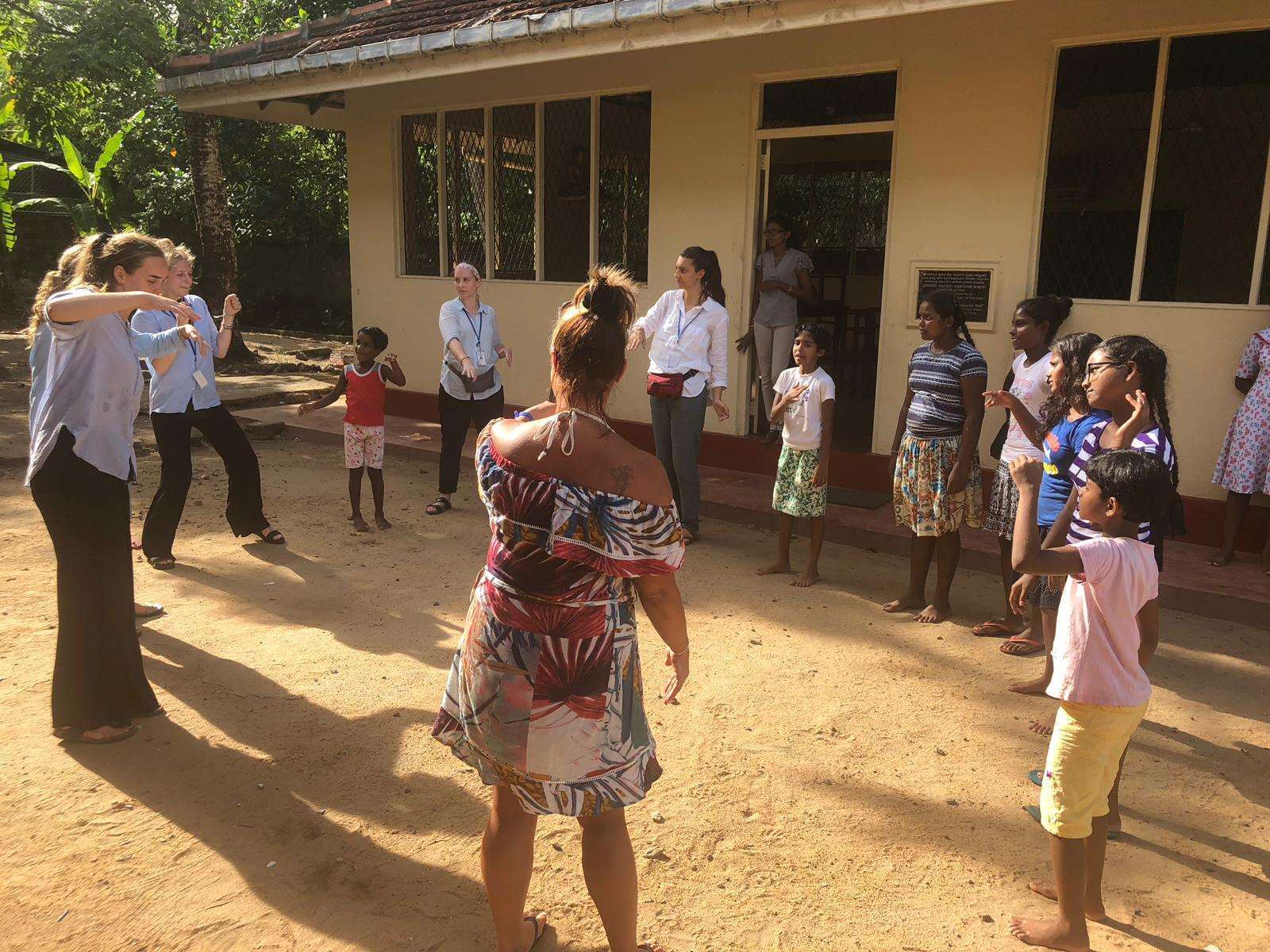 The newly married couple got involved with activities with the girls at the orphanage (6772597)