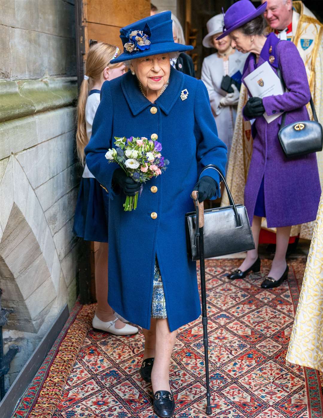 The Queen uses a walking stick at the Service of Thanksgiving at Westminster Abbey (Arthur Edwards/The Sun/PA)