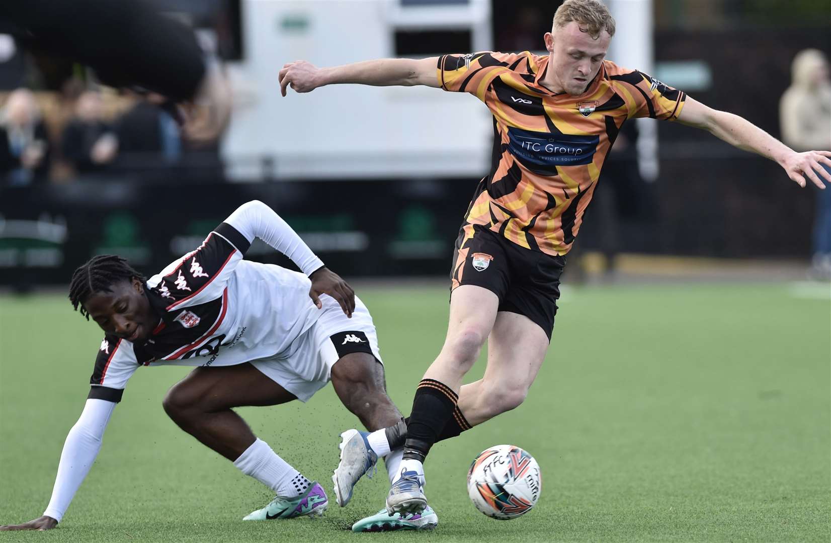 Lordswood's Callum Peck up against Faversham defender Rahman Kareem. Picture: Ian Scammell