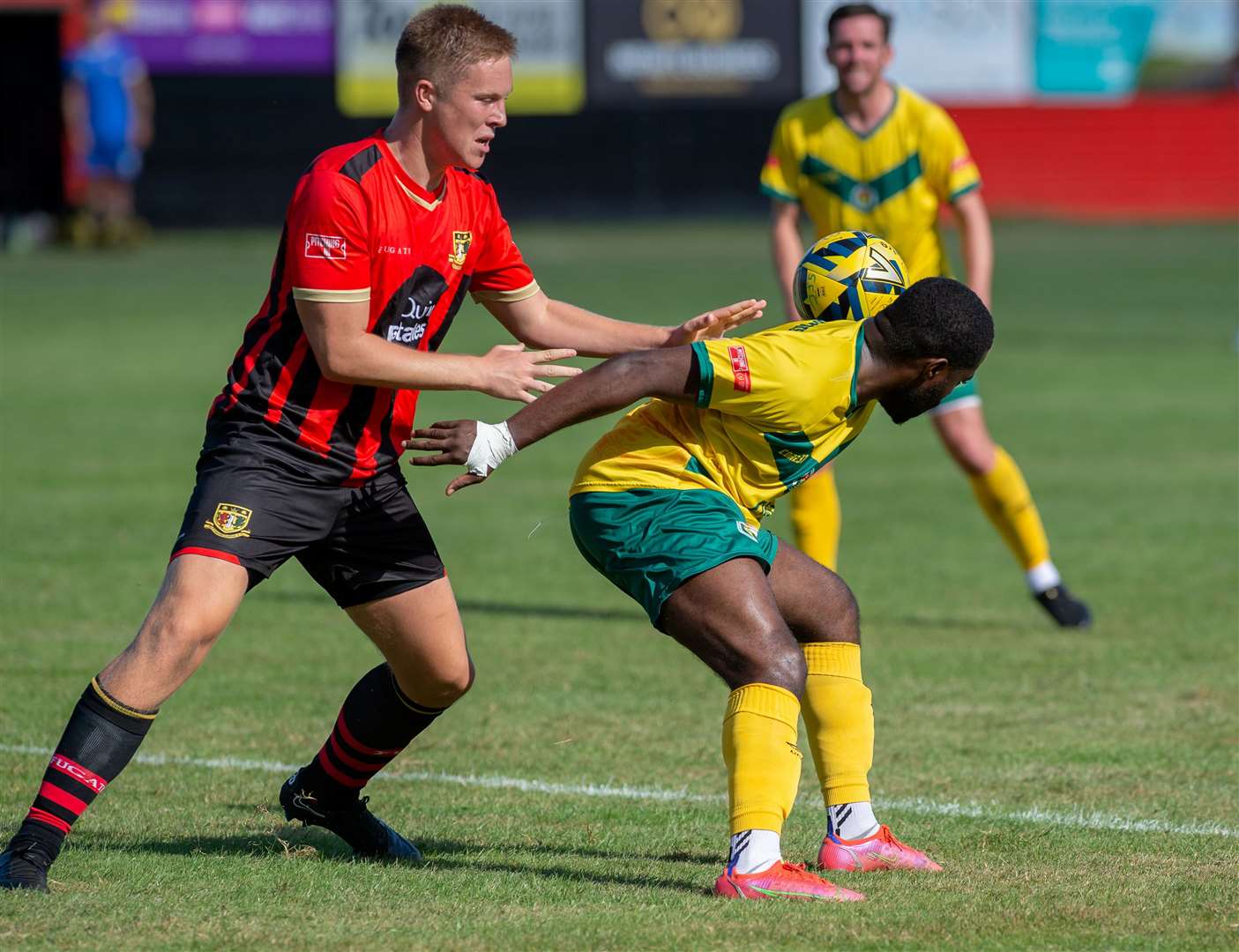 Sittingbourne defender Joe Tyrie, left, in Kent Senior Cup action against Ashford. Picture: Ian Scammell/Isobel Scammell