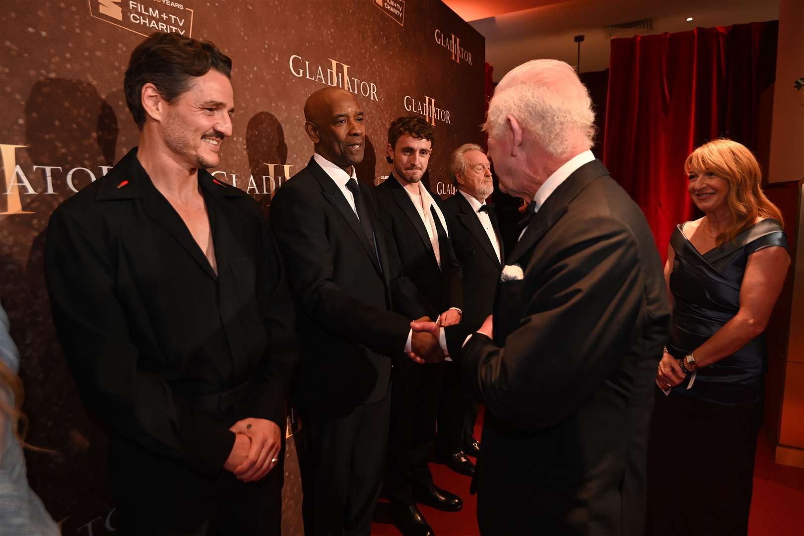 The King meets Pedro Pascal, Denzel Washington and Paul Mescal at the Gladiator II premiere (Eddie Mulholland/The Telegraph/PA)