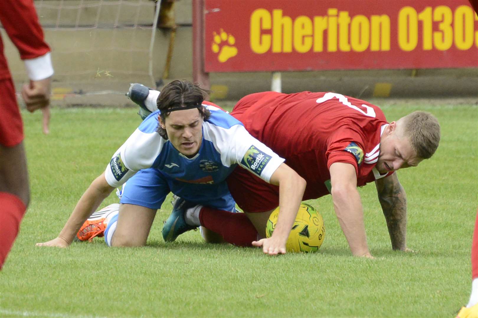 Hythe's Charlie Webster and Tonbridge's Tommy Whitnell tangle on the ground. Picture: Paul Amos