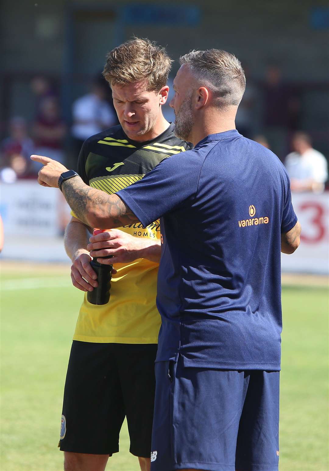 Sonny Miles talks tactics with Tonbridge boss Jay Saunders. Picture: David Couldridge