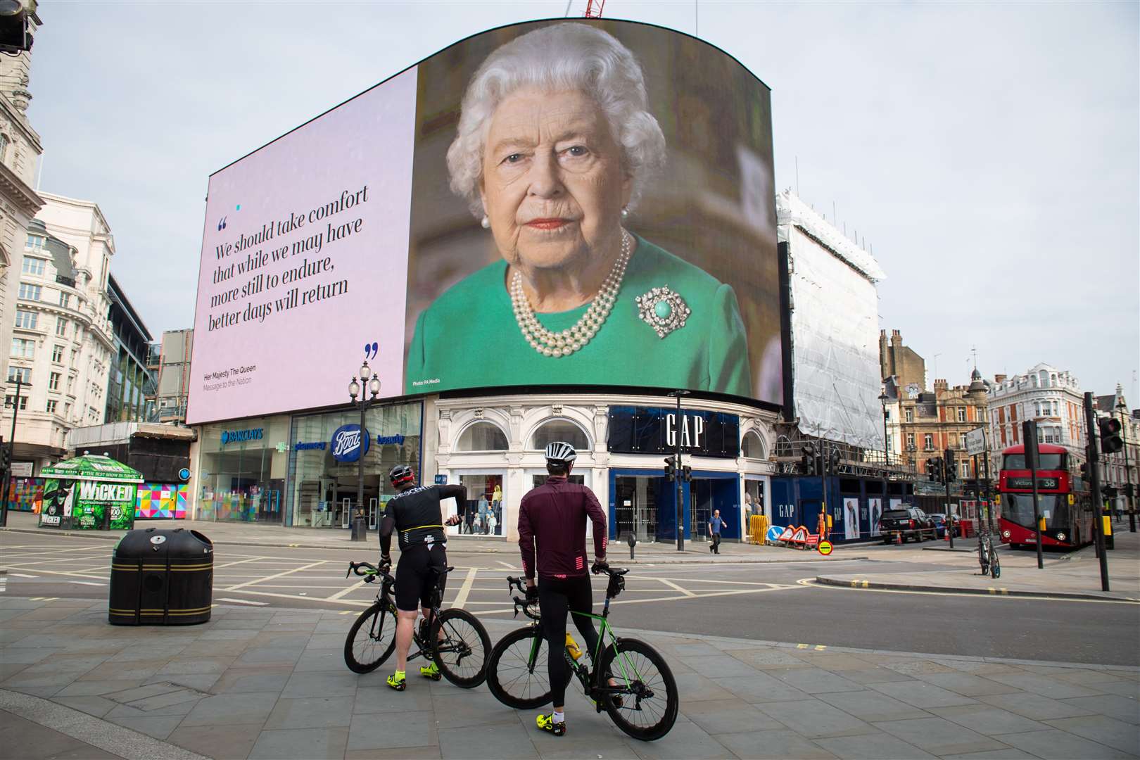 An mage of the Queen’s broadcast to the nation is displayed in lights at London’s Piccadilly Circus (Dominic Lipinski/PA)