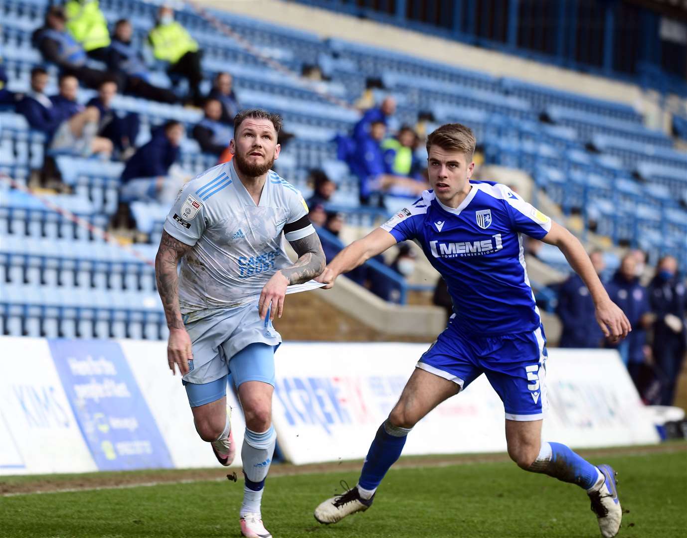 Ipswich striker James Norwood is held back by Gills defender Jack Tucker Picture: Barry Goodwin