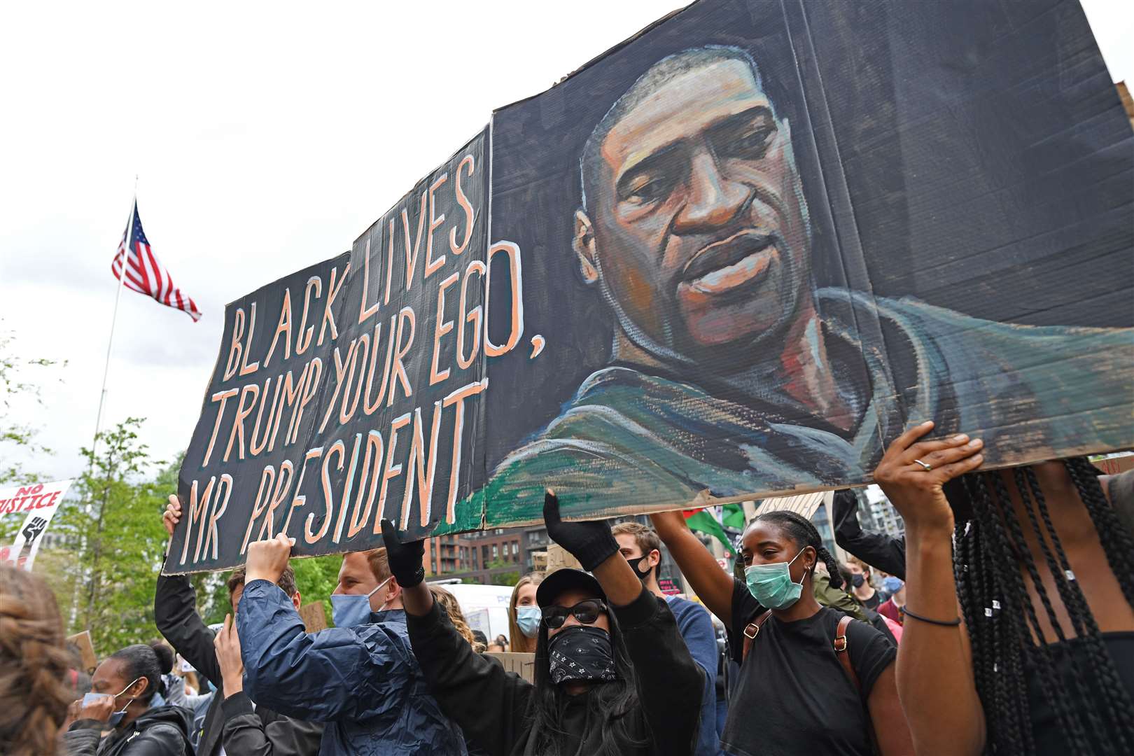 People take part in a Black Lives Matter protest rally at the US Embassy, London, in memory of George Floyd (Stefan Rousseau/PA)