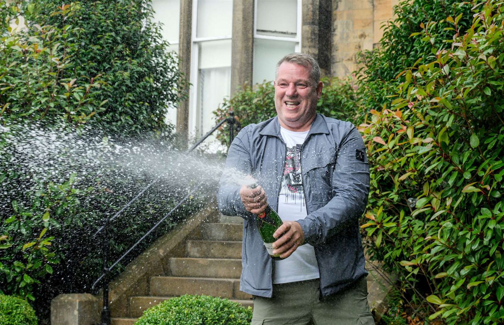 John McDowell celebrates his National Lottery win (Alan Peebles/PA Wire)