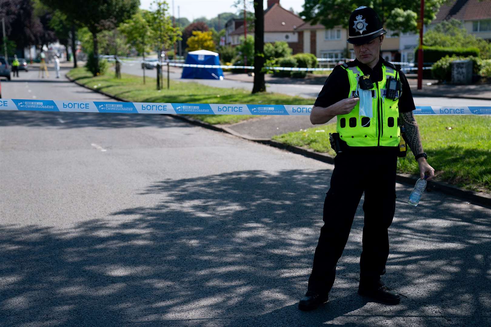 A police officer stands near the scene (Jacob King/PA)