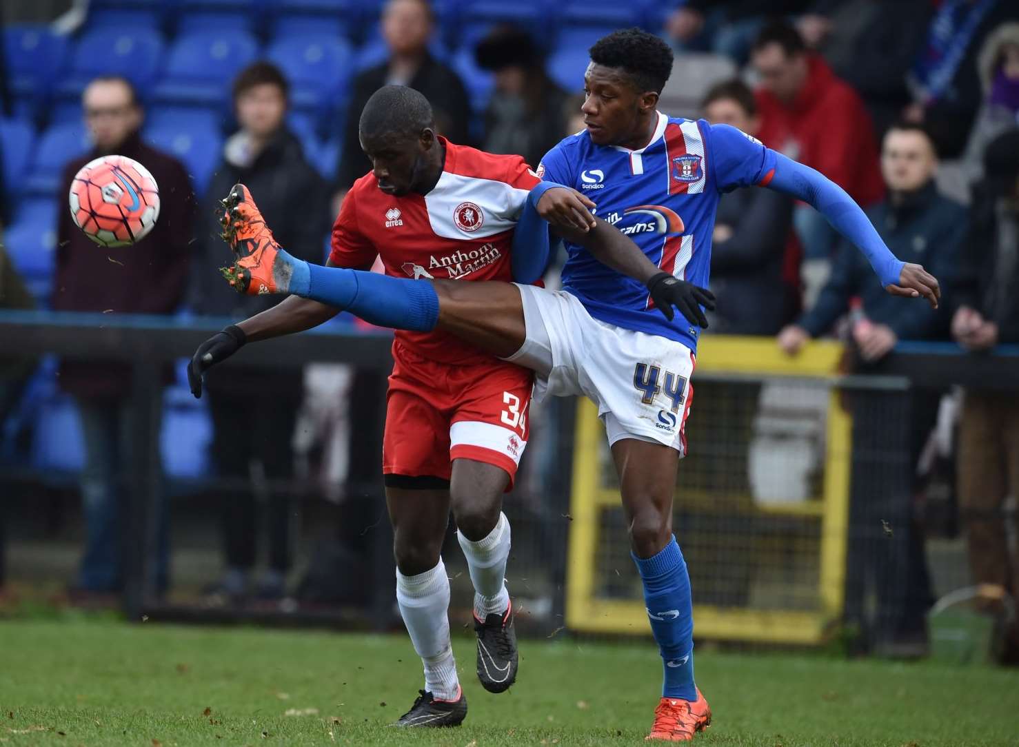 Michael Bakare challenges with Alex McQueen. Picture: Keith Gillard