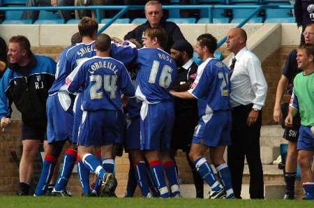 DELIGHT: The Gillingham players mob Darren Byfield after the striker's late winner. Picture: GRANT FALVEY