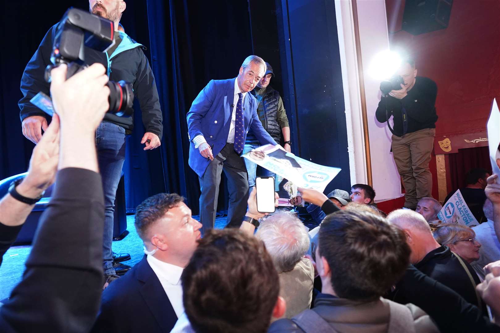 Signing posters after speaking at Princes Theatre in Clacton on June 18 (Ian West/PA)