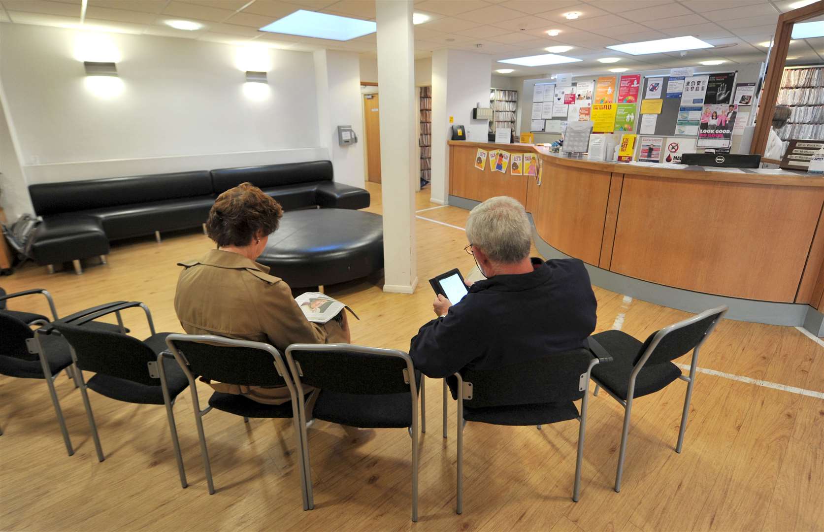 Patients sitting in the waiting room at a GP practice (Anthony Delvin/PA)