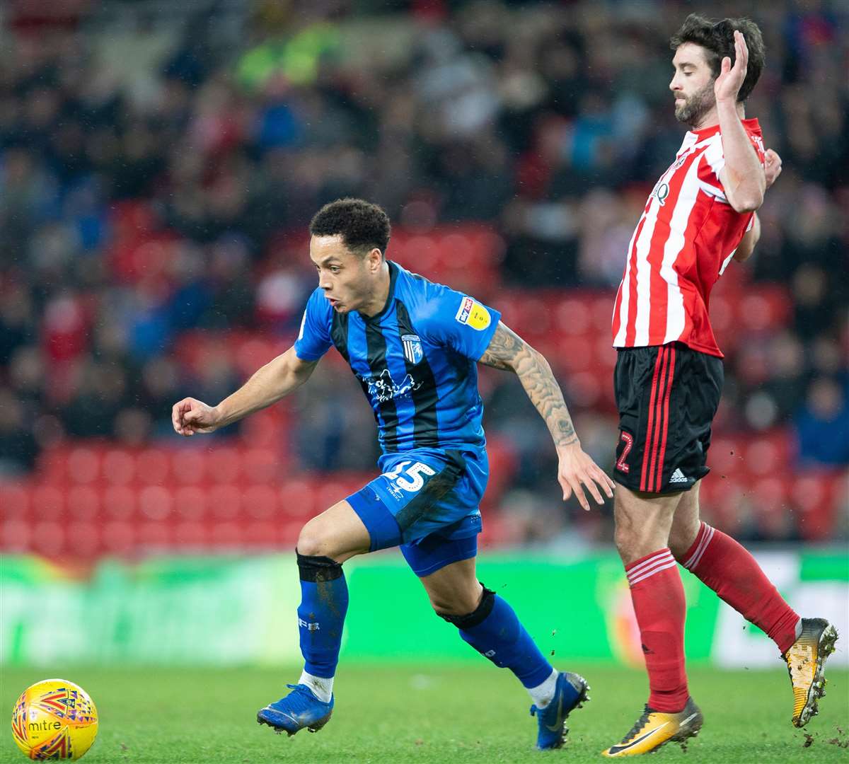 Substitute Elliott List skips away from Will Grigg Picture: Ady Kerry