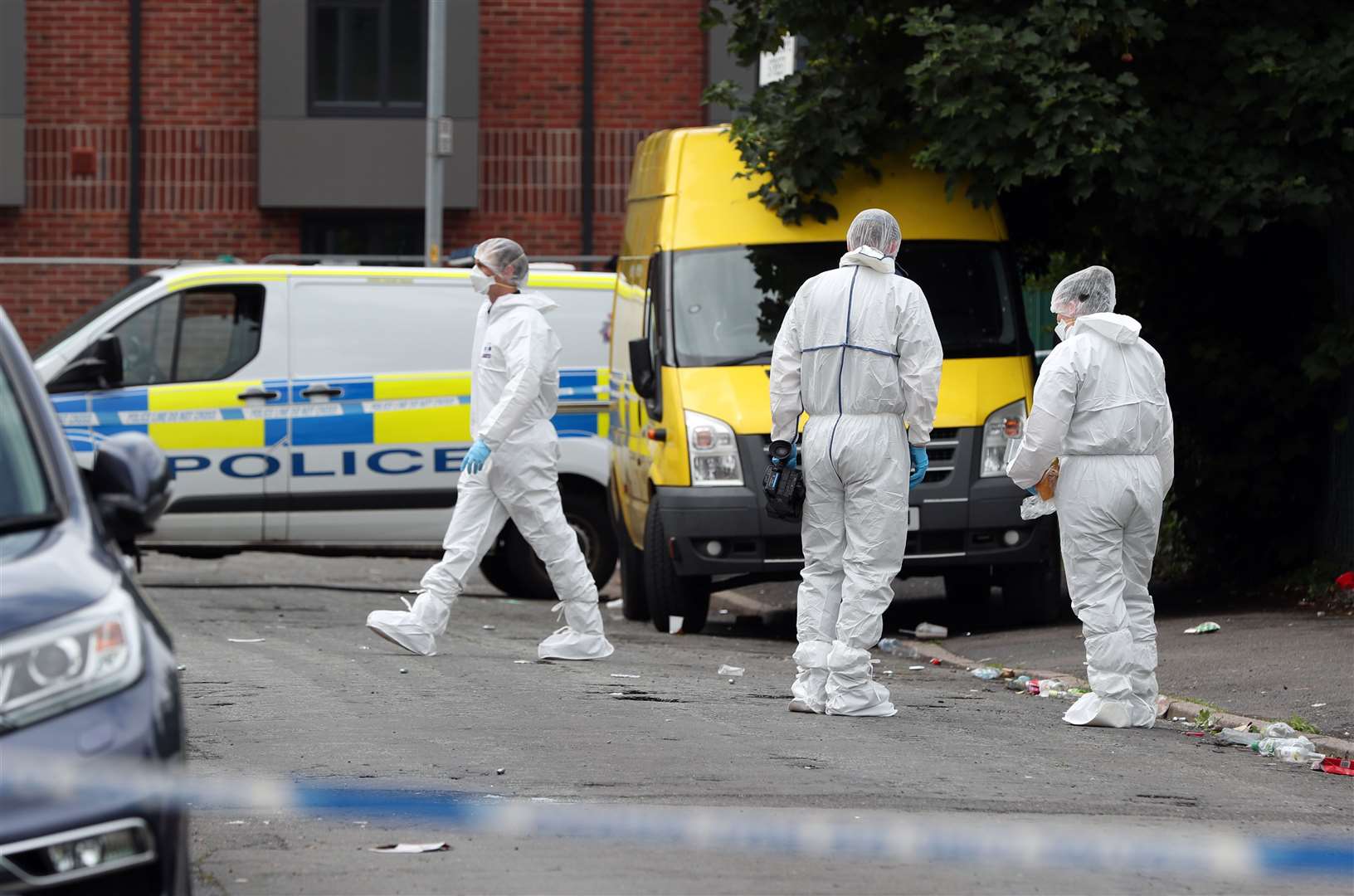 Police at the scene in Moss Side (Peter Byrne/PA)