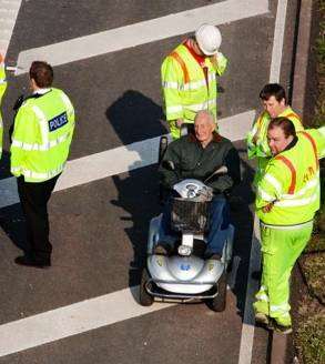 An elderly man on the M20 near the Channel Tunnel entrance in a mobility scooter in April last year