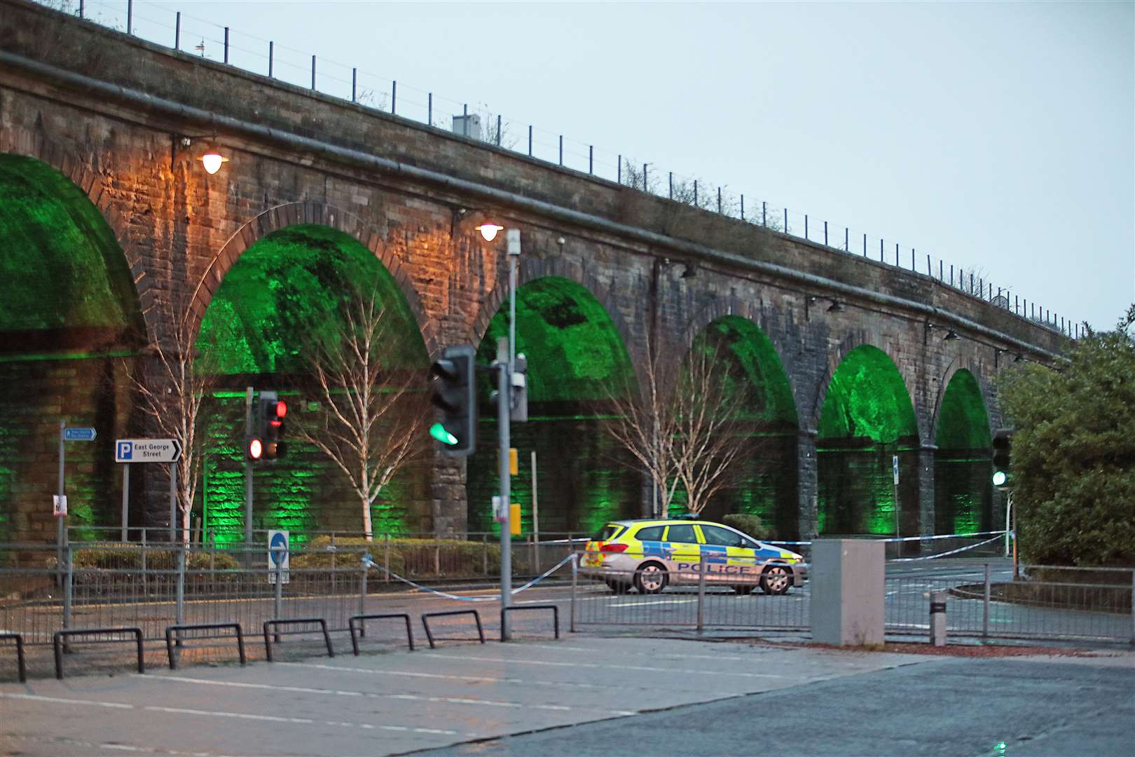 A police cordon at Green Street, alongside a railway viaduct in Kilmarnock (Jane Barlow/PA)